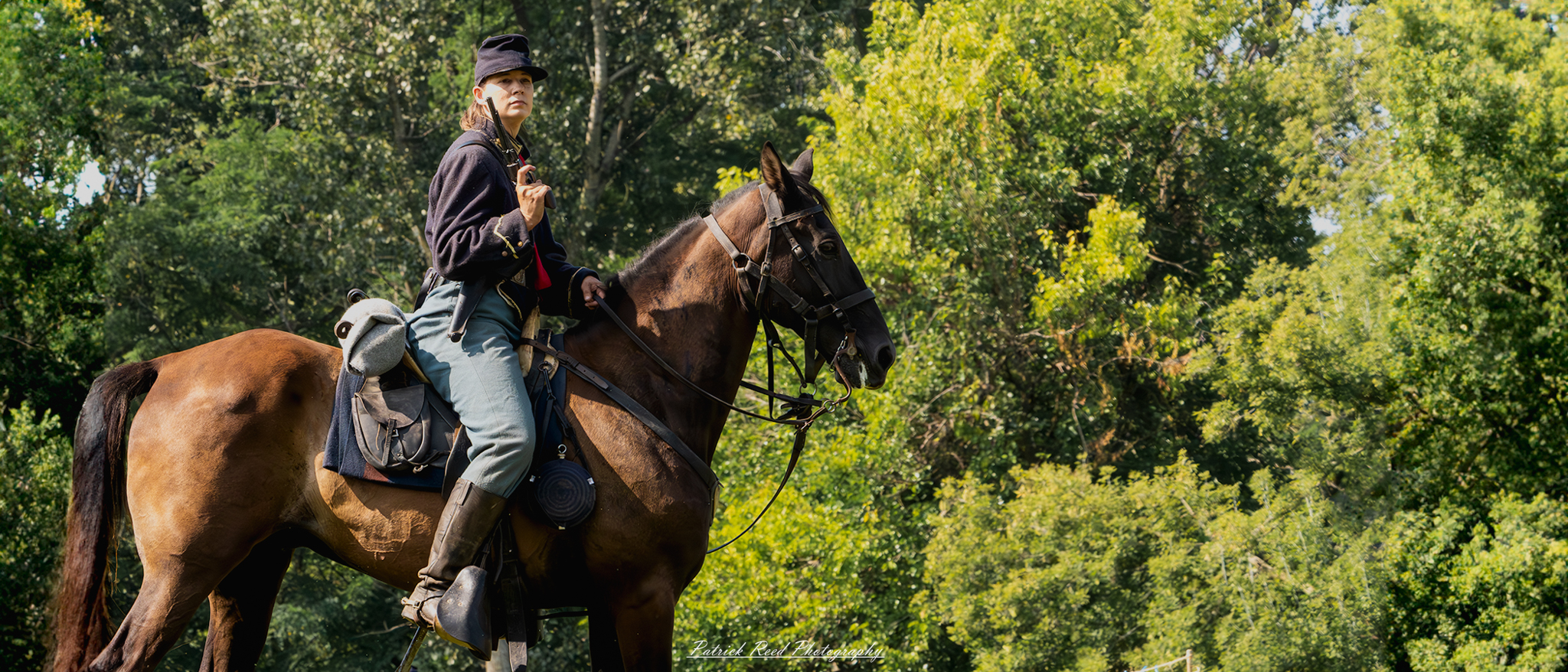 A female cavalry soldier on horseback, holding a pistol in one hand while maintaining control of the reins with the other. Dressed in a military uniform, she exudes confidence and determination, showcasing her readiness for action and the significant role of women in cavalry units.